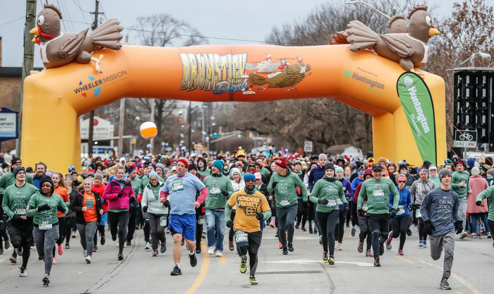 Runners and walkers at the Wheeler Mission Drumstick Dash in Broad Ripple, Indianapolis